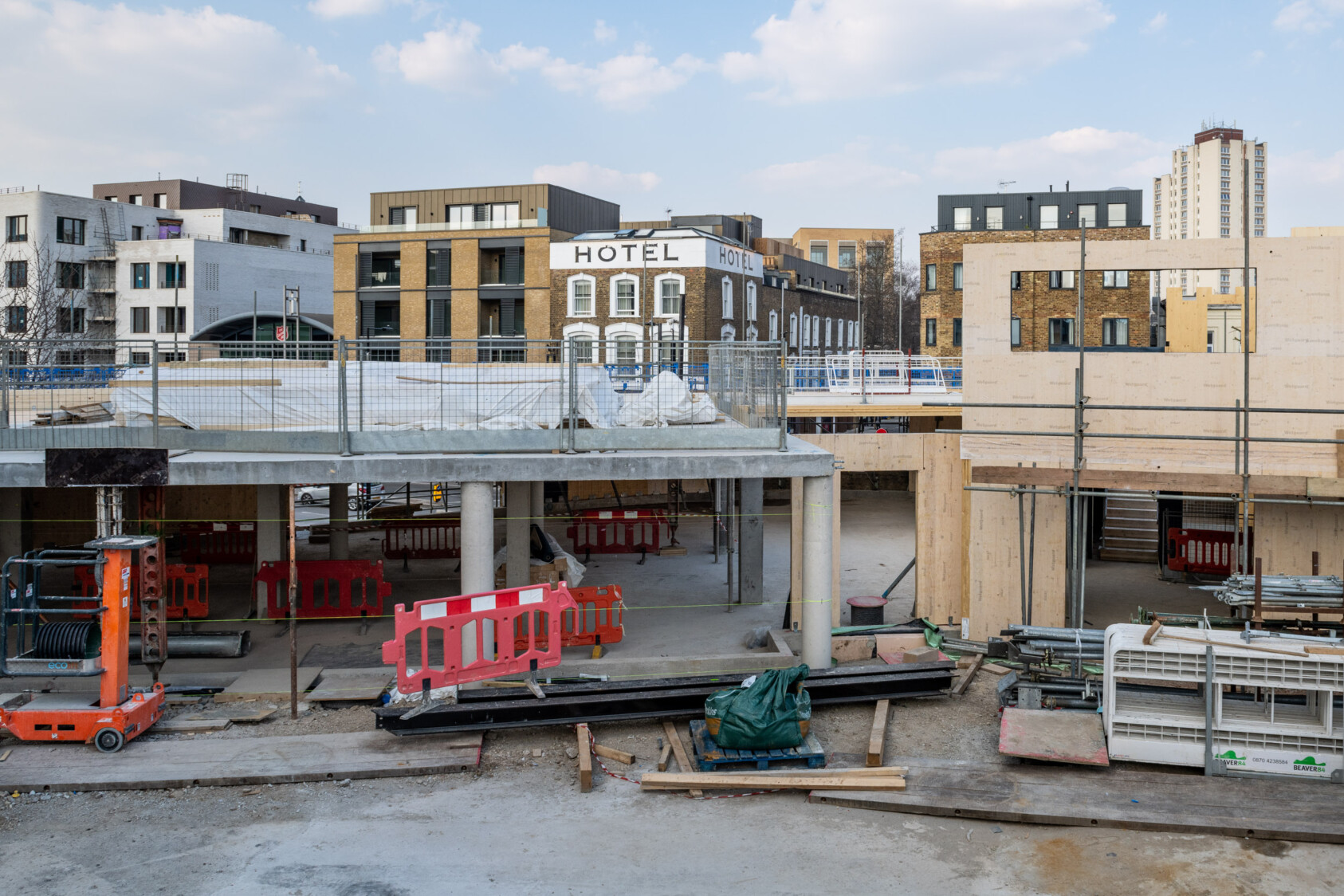 Concrete and wooden structures start to form as the building takes shape.