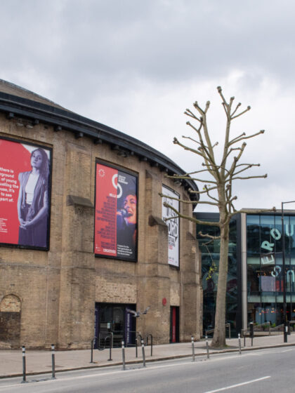 A view from the front of the Roundhouse where you can see the main building and the new building coming out of the ground to the right of the Roundhouse.