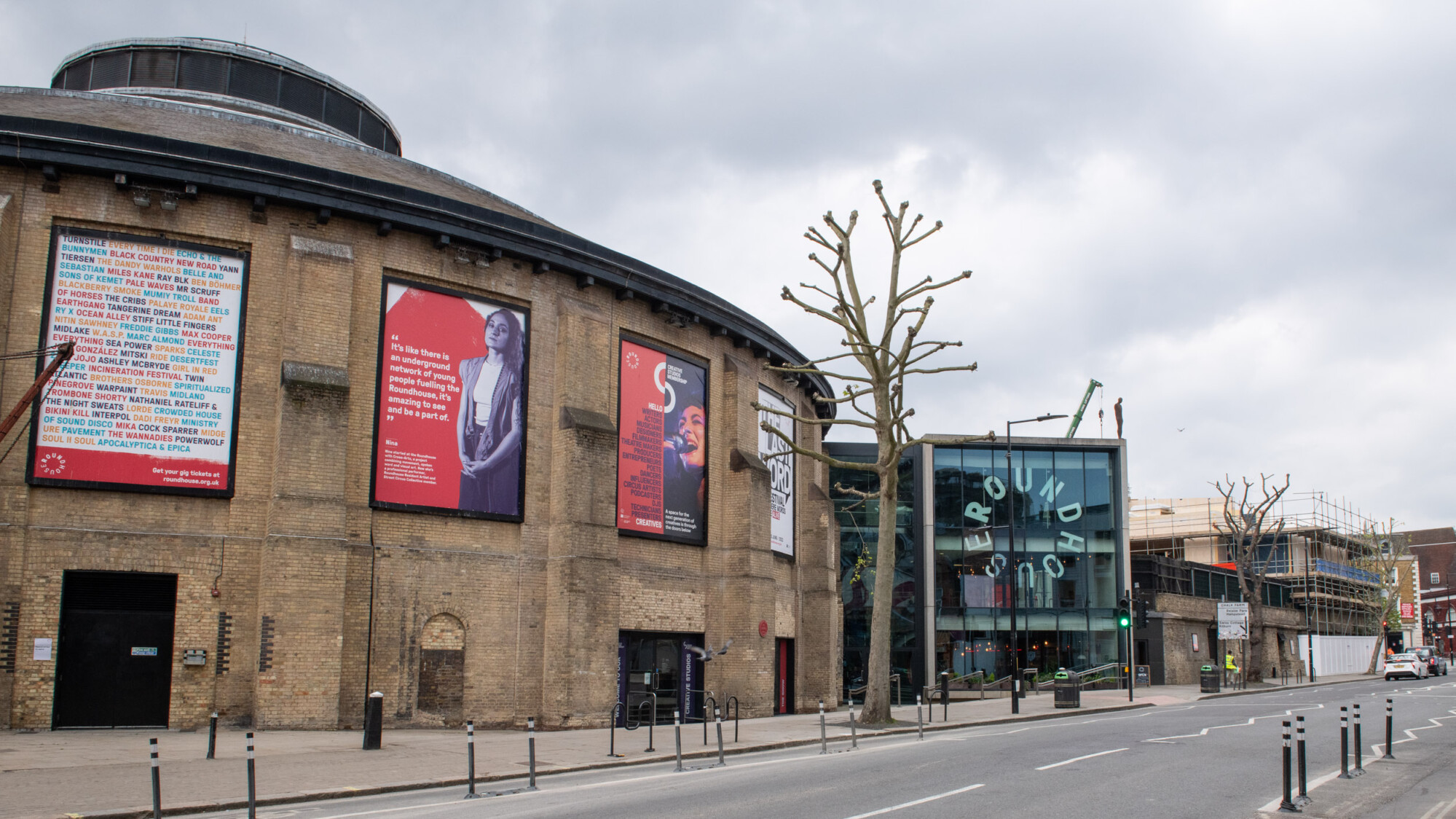 A view from the front of the Roundhouse where you can see the main building and the new building coming out of the ground to the right of the Roundhouse.