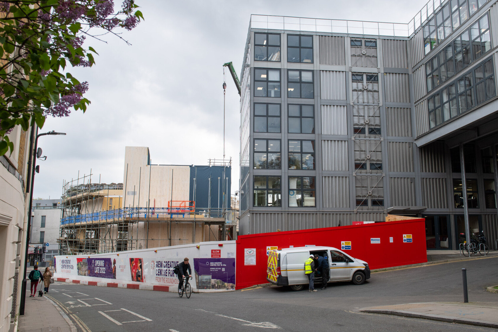 The wooden walls start to take shape along the side road and next to the Roundhouse’s offices which are grey shipping containers.