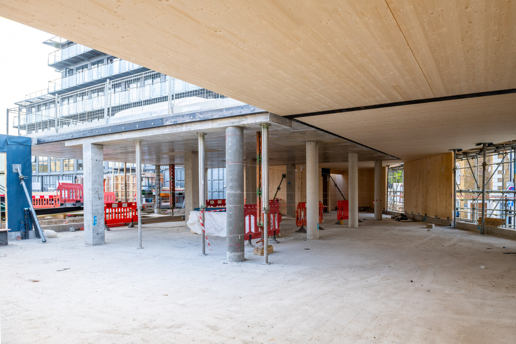 Inside the first floor of the building which shows concrete pillars - this room will eventually be the workspace.