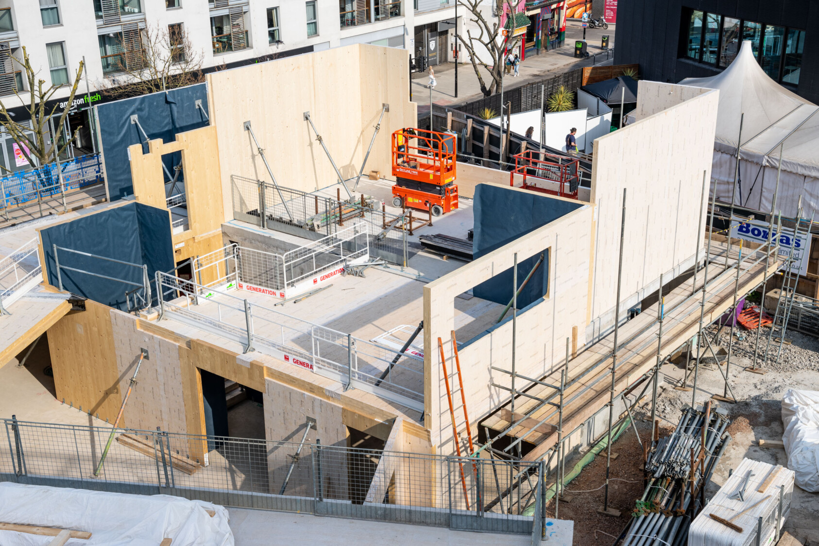 A close up view of the second floor of the building taking shape.