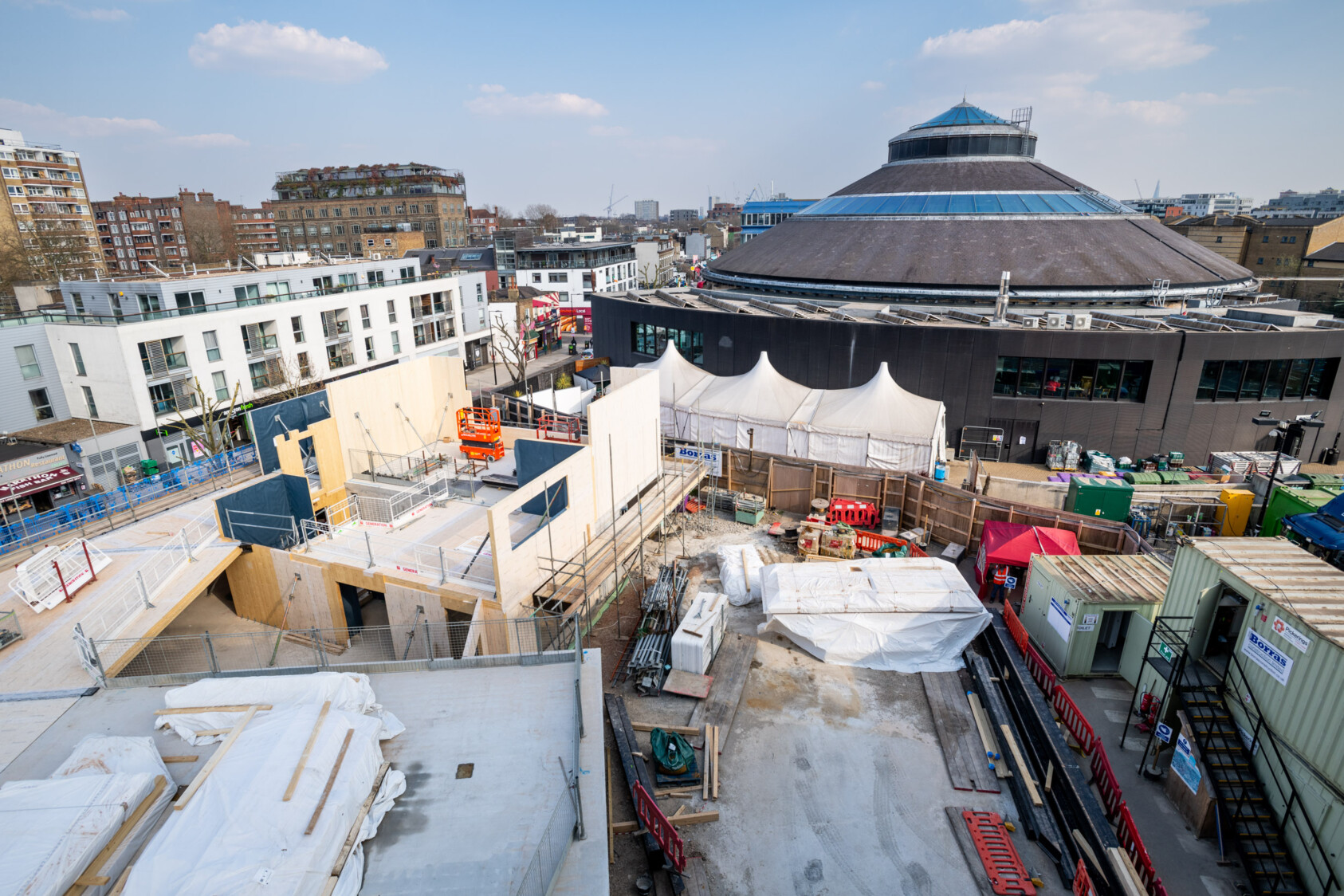 The first and second floor of the new building take shape with the Roundhouse in the background.