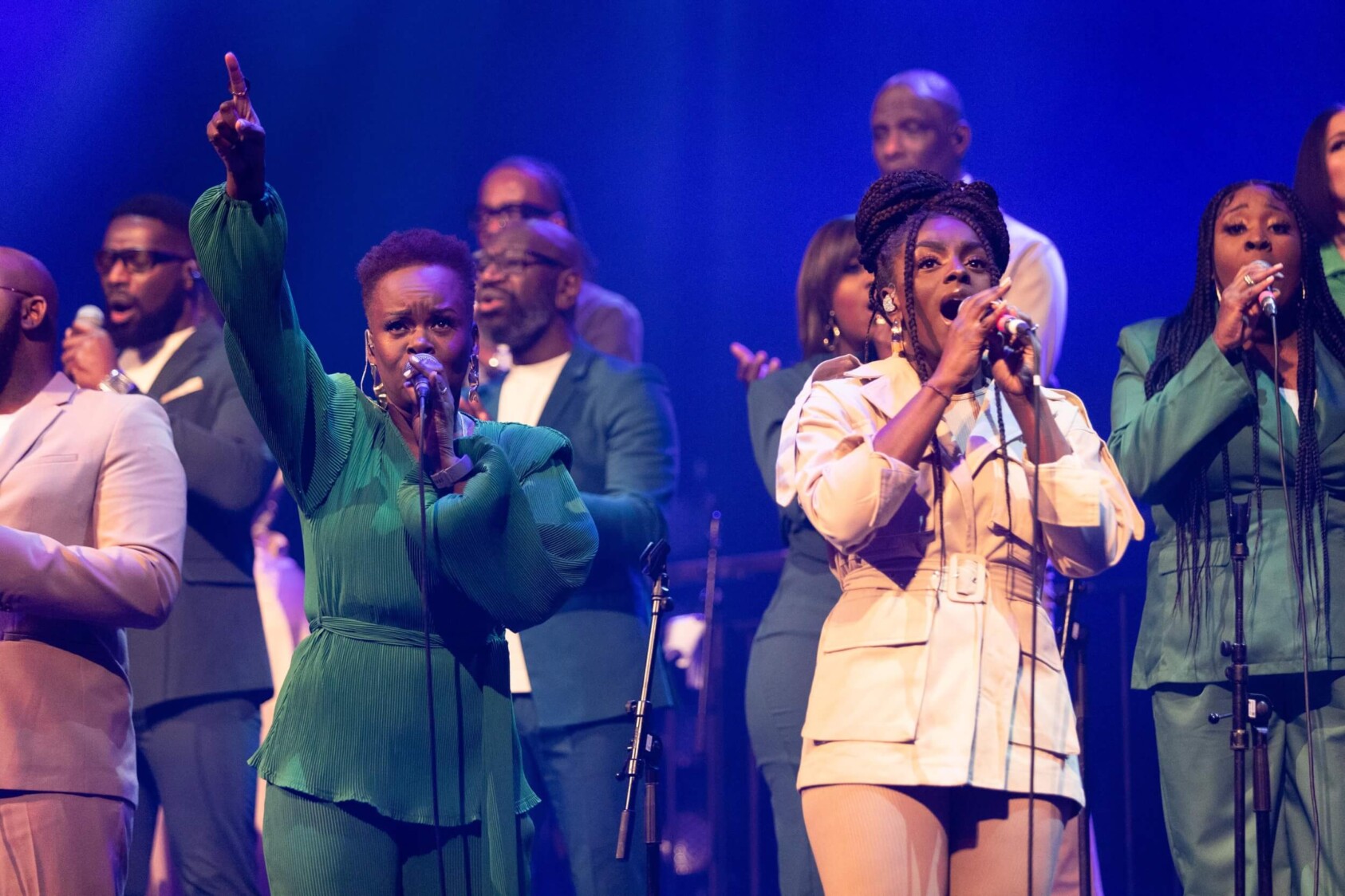 Members of The Kingdom Choir singing on stage at the Roundhouse.