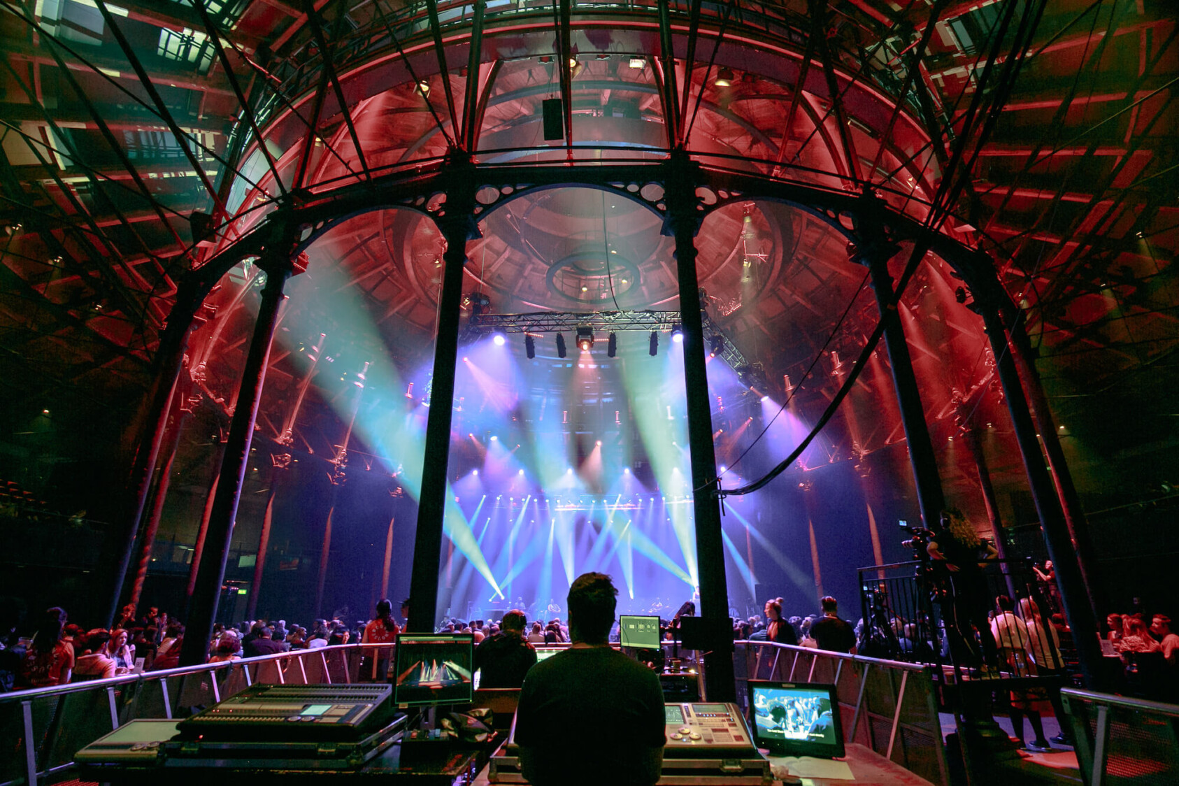 The interior of the Roundhouse auditorium lit purple from the inside