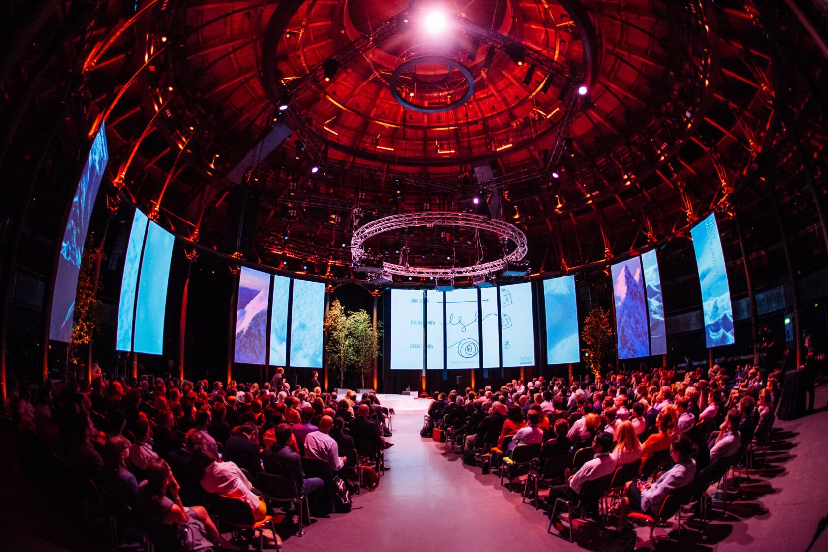 Photo of Ellen MacArthur Foundation Annual Summit event in the Main Space, with many attendees seated