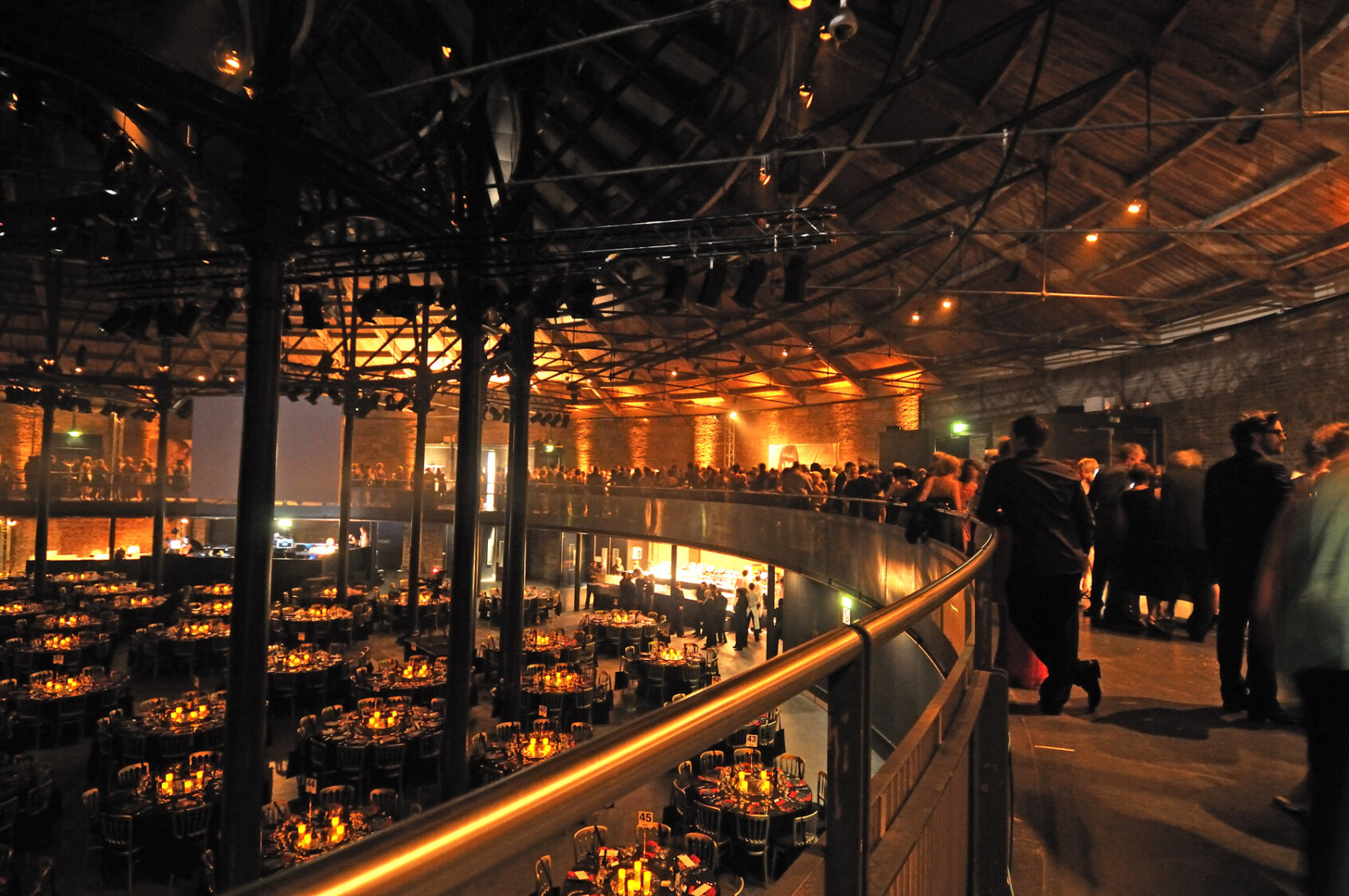 Guests gathered for dinner on the balcony above the Main Space