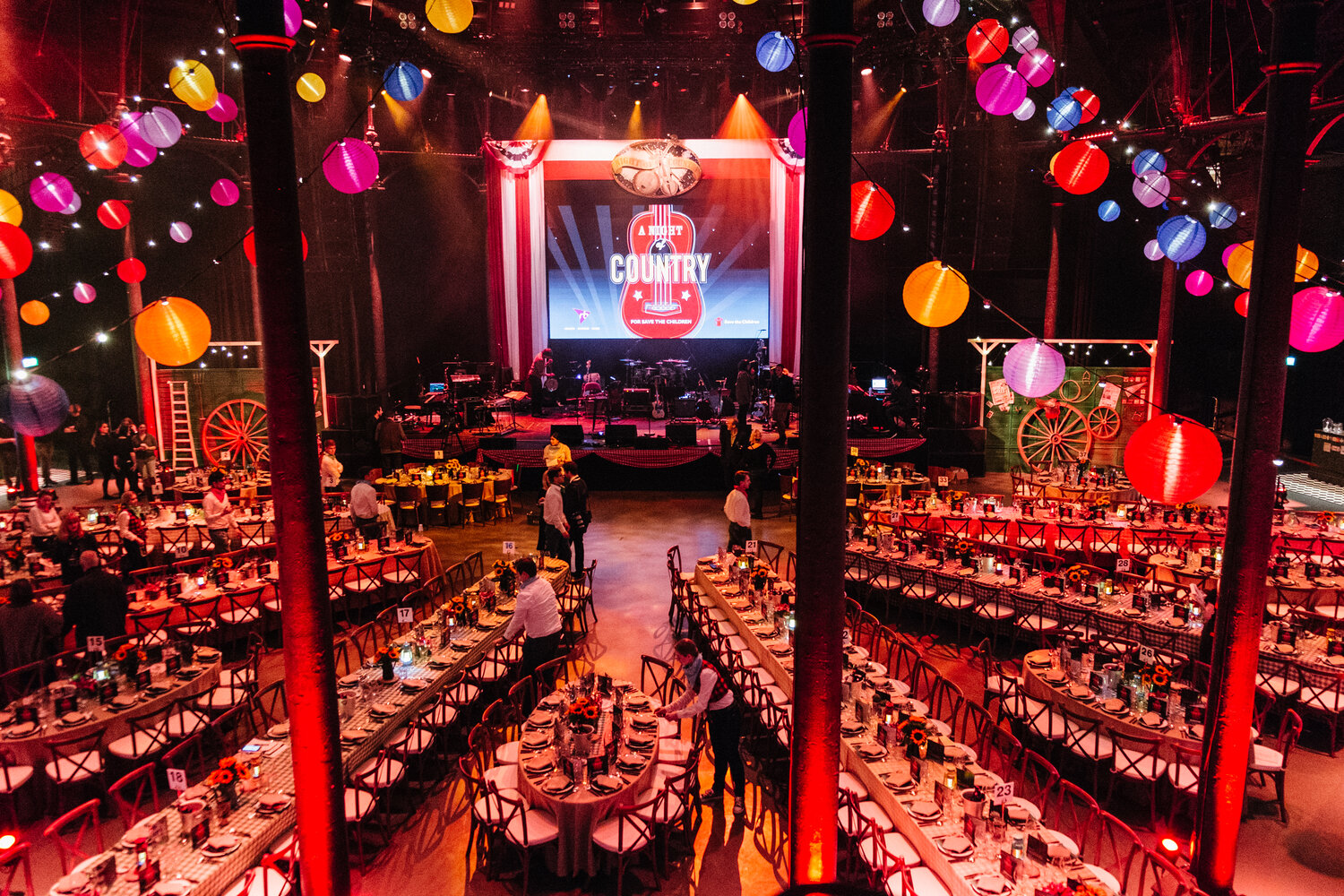 Long tables set up at Save The Children event in the Main Space