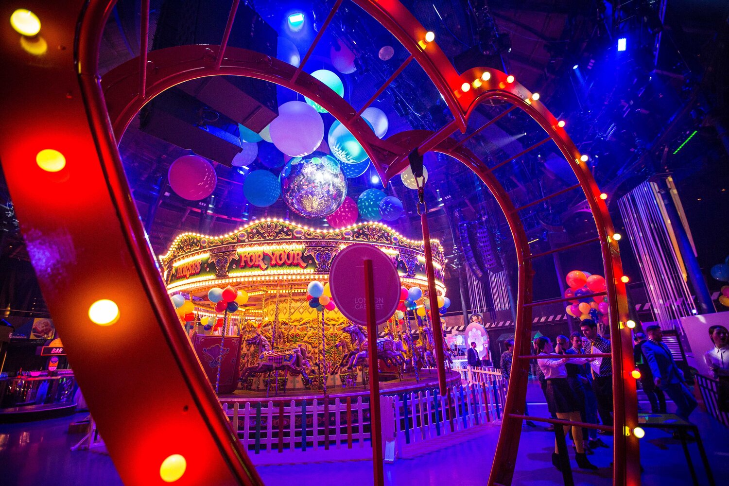 Heart shaped lighting and a Victorian Carousel set up in the Main Space for a celebration event