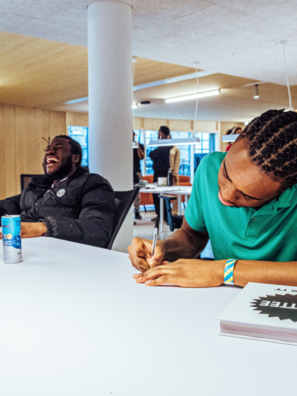 two young people working at a desk in roundhouse works