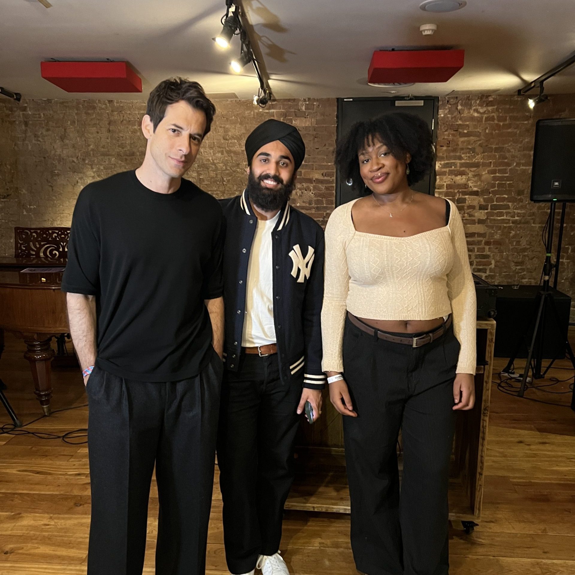 Three people pose for the camera.