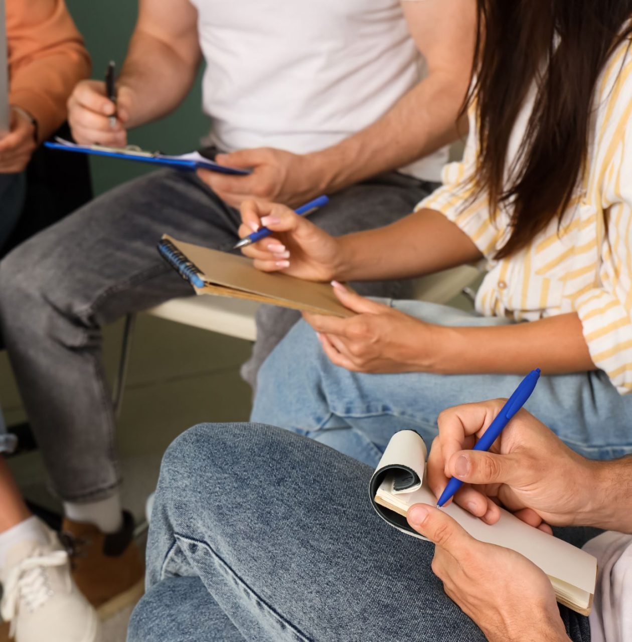 group of young people writing poetry