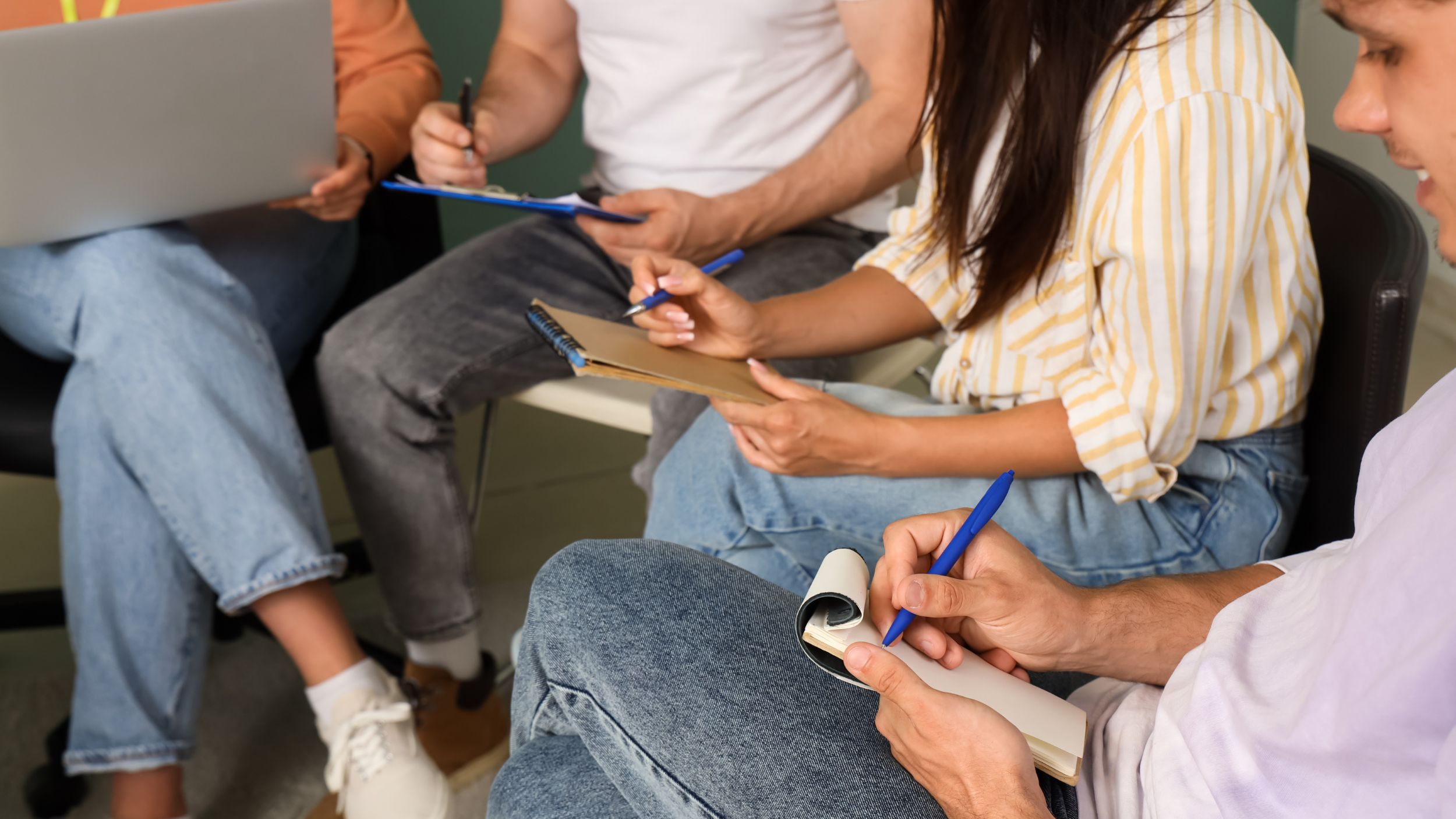 group of young people writing poetry