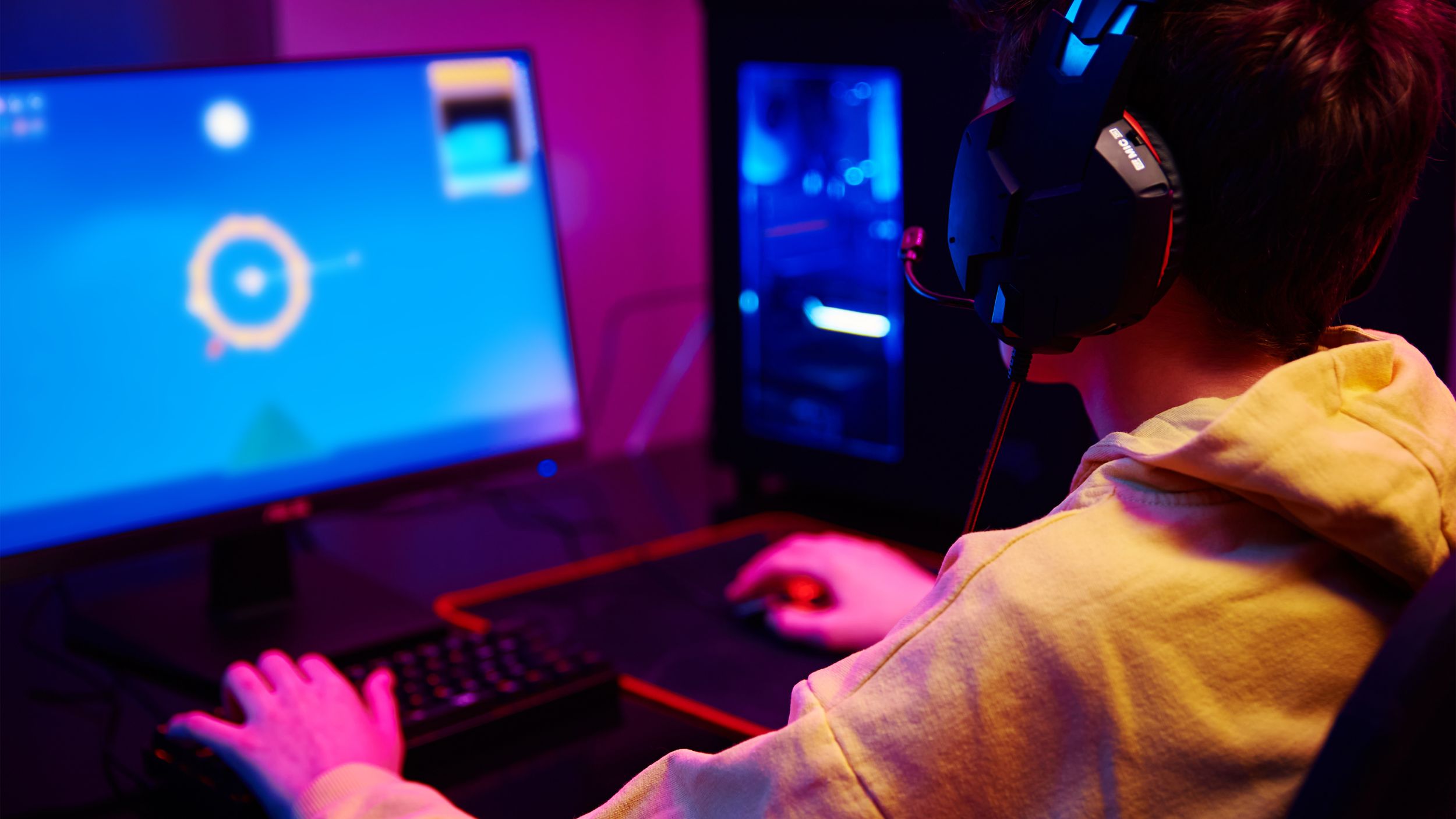 a young person creating a game on a laptop